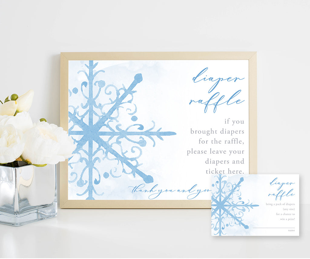 Blue snowflake diaper raffle sign and card.