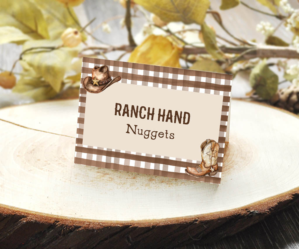 Cowboy birthday food tent card for ranch hand nuggets with brown gingham and cowboy gear.