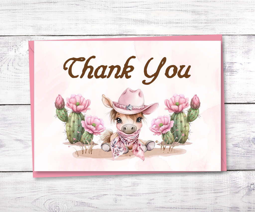 First rodeo girls birthday thank you card with cute baby pony in cowgirl hat and flowering cacti.