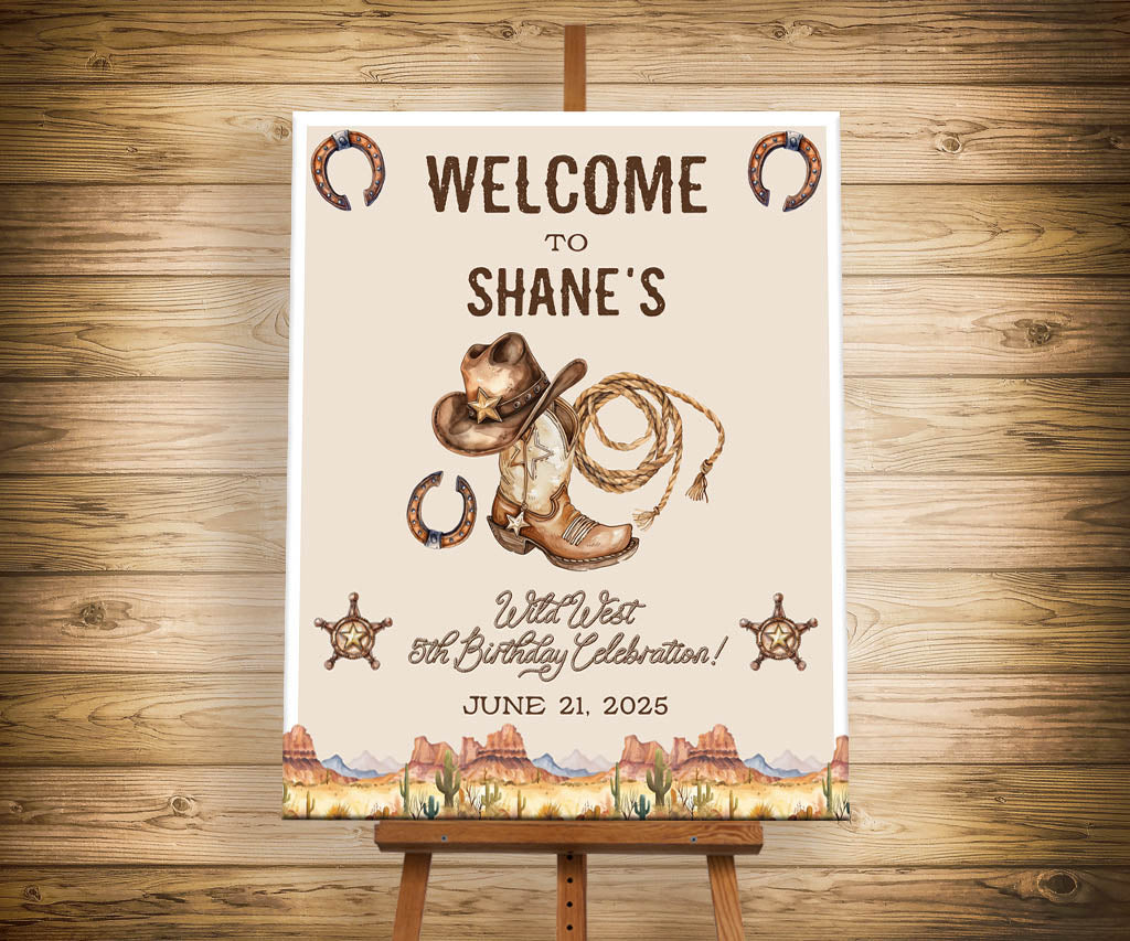 Wild west cowboy birthday welcome sign on easel with cowboy boot, cowboy hat, lasso, horseshoes and star badges.