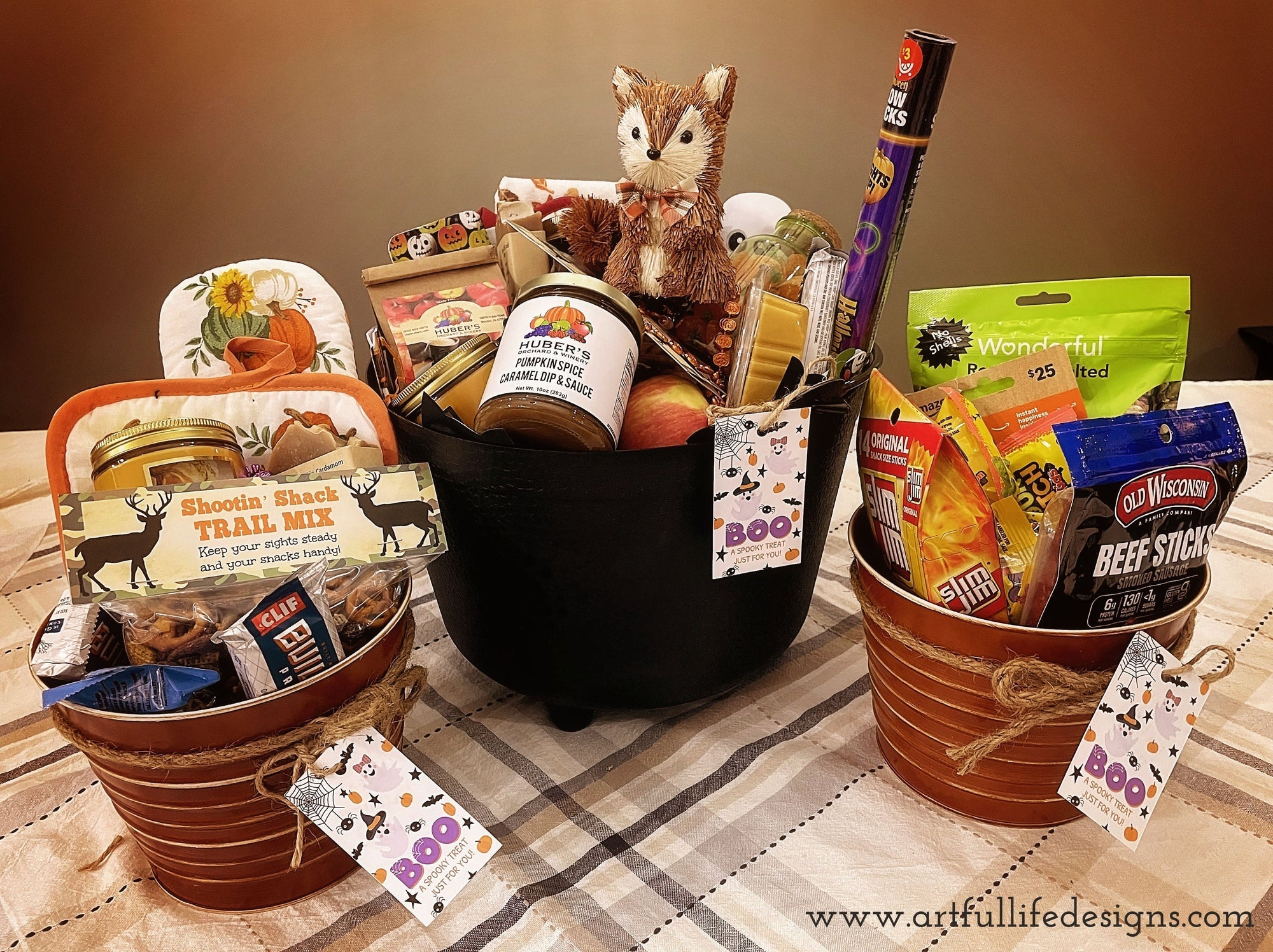 Three Boo Baskets filled with various treats, candy & goodies from Artful Life Designs.