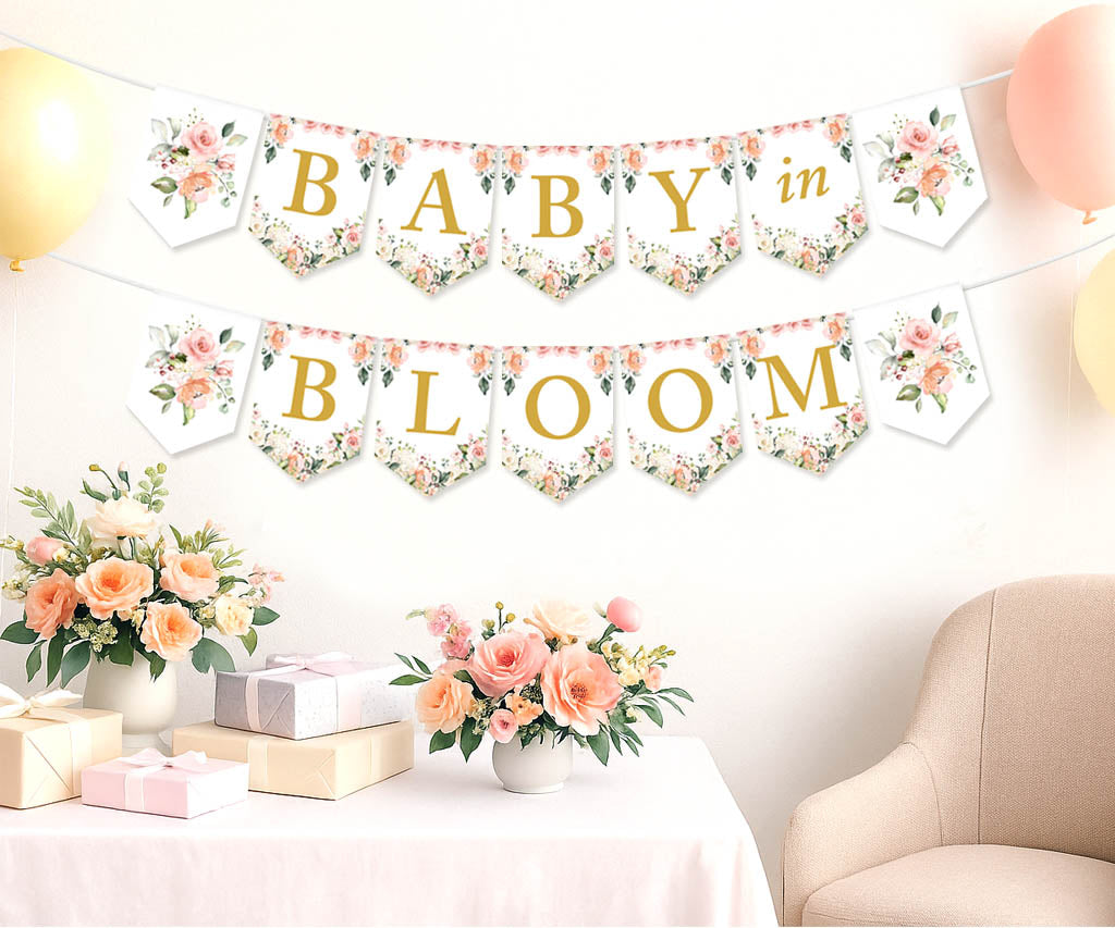 Decorative banner with &#39;Baby in Bloom&#39; text in a room with flowers and balloons.