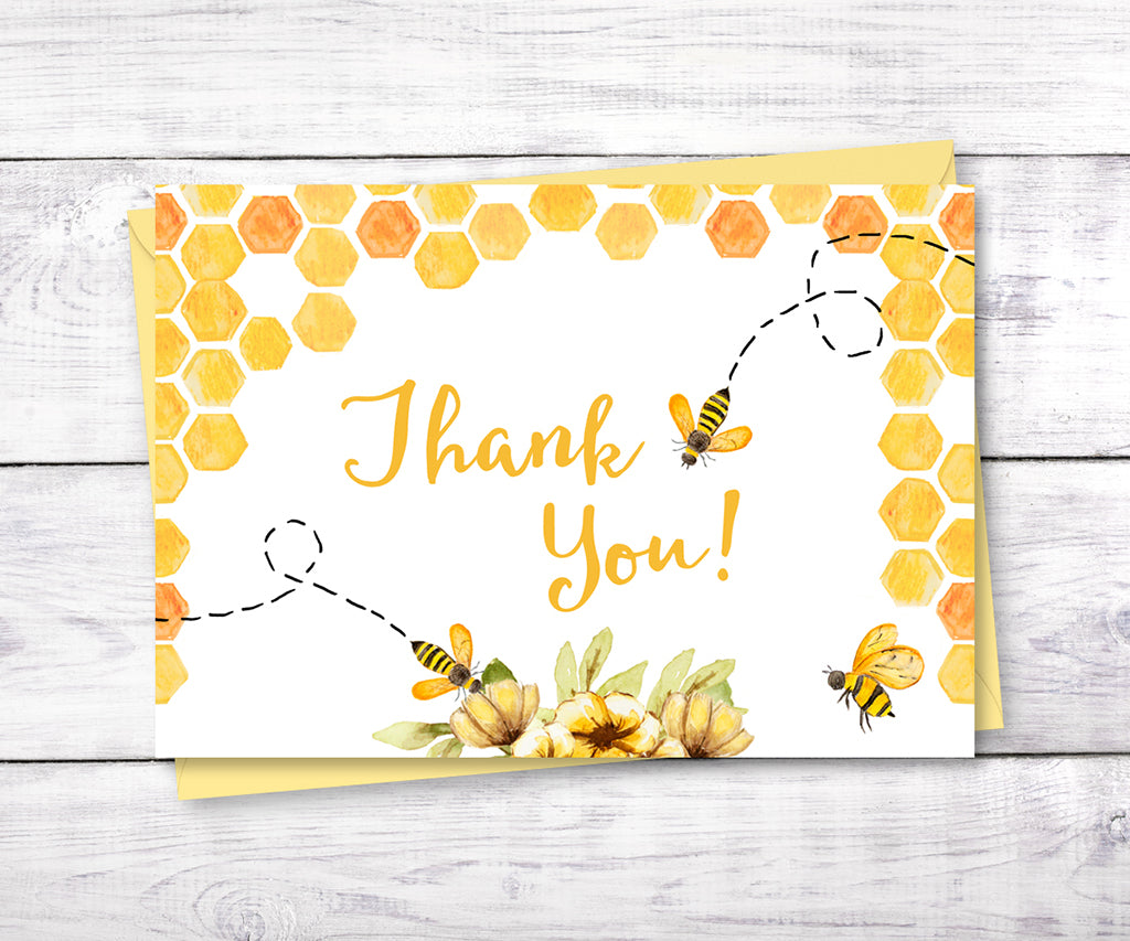 Bee baby shower thank you card with honeycomb, bees and yellow flowers.