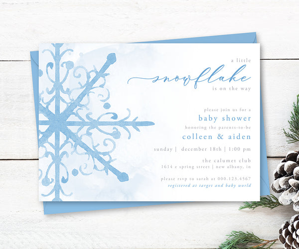 Blue snowflake winter baby shower invitation.