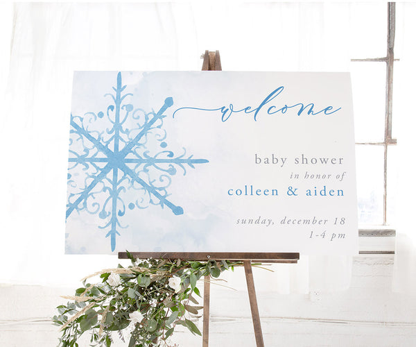 Blue snowflake winter baby shower welcome sign.