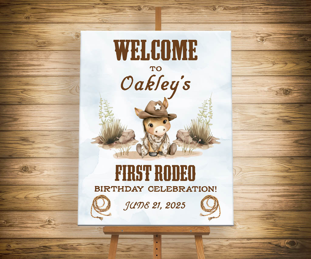 First Rodeo birthday welcome sign on easel featuring a sweet baby pony in a cowboy hat.