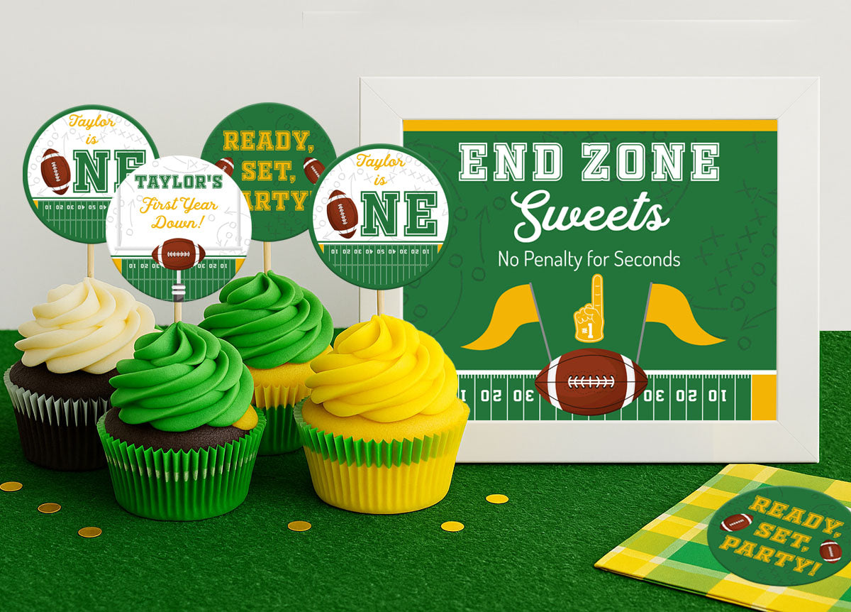 Football cupcake toppers in green and gold on chocolate cupcakes with green, yellow and white icing and a table sign reading END ZONE Sweets, No Penalty for Seconds.