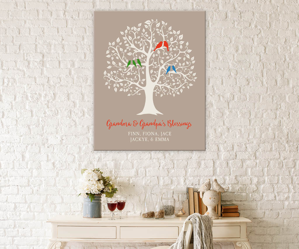 Decorative wall art of grandma & grandpa's blessings family tree with birds displayed on a brick wall.