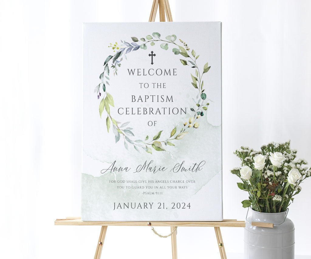 Greenery baptism welcome sign on easel.