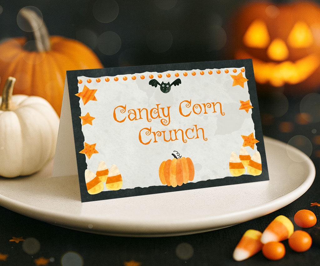 Halloween food tent card with candy corn, stars, pumpkin and bat.