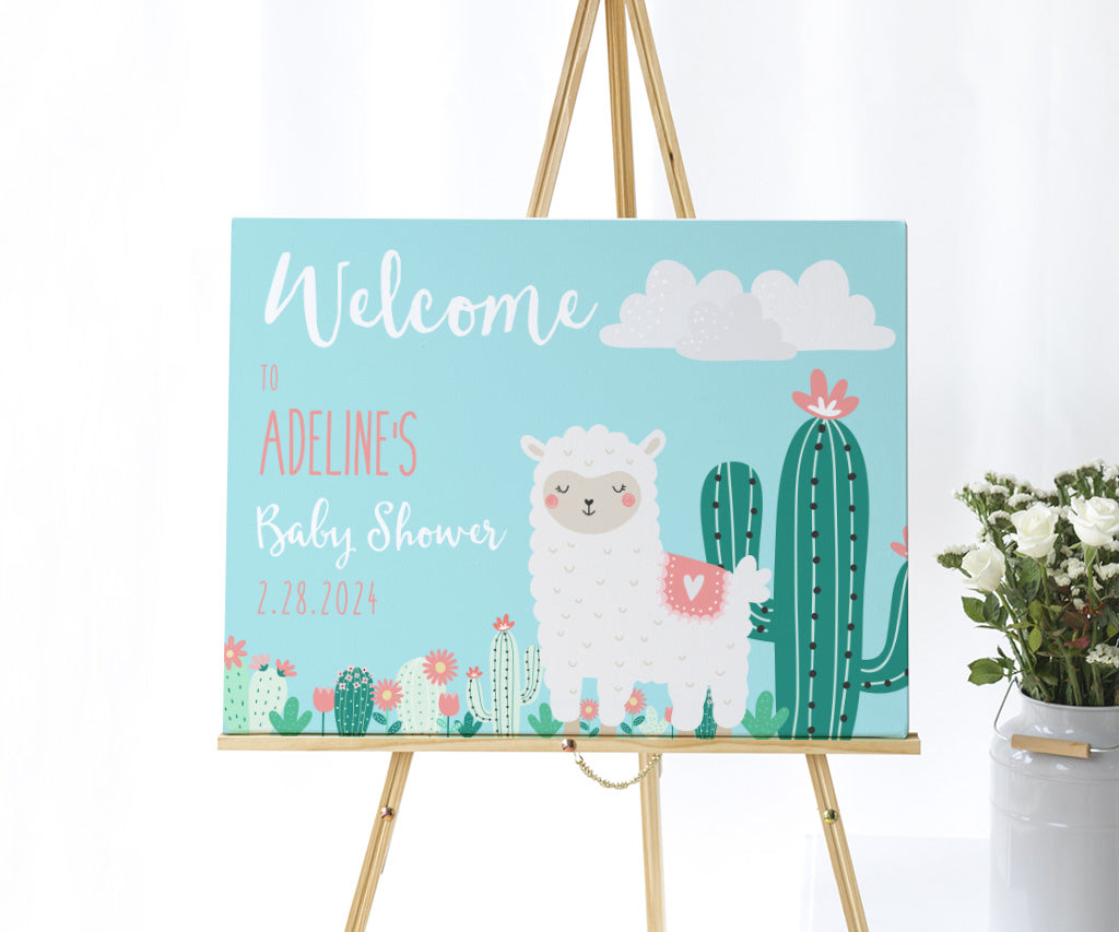 Llama baby shower welcome sign on an easel.
