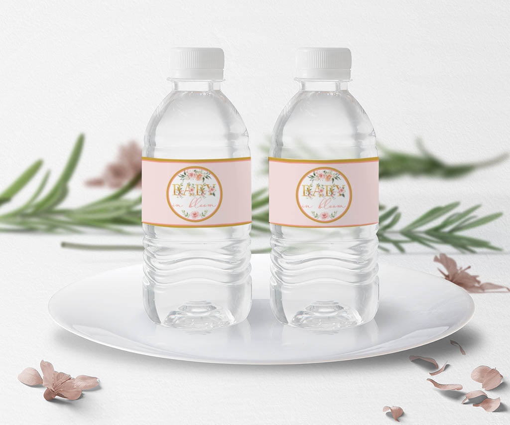 Pink floral baby in bloom bottle wrappers on two water bottles. 