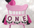 Pink buffalo plaid one year highchair banner.