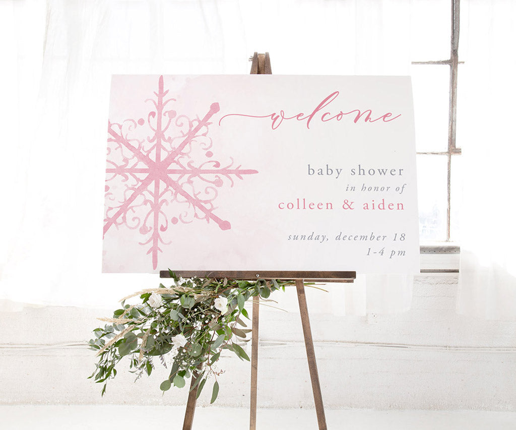 Pink snowflake winter baby shower welcome sign.