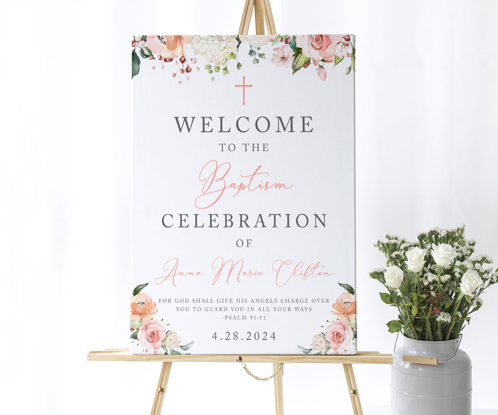 Pink and white floral baptism welcome sign on an easel.