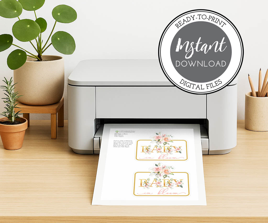 Printed floral cake topper with gold script text, ready to cut and attach for DIY baby shower cake decoration.