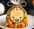 Round Halloween favor tag with a cauldron and black cats.