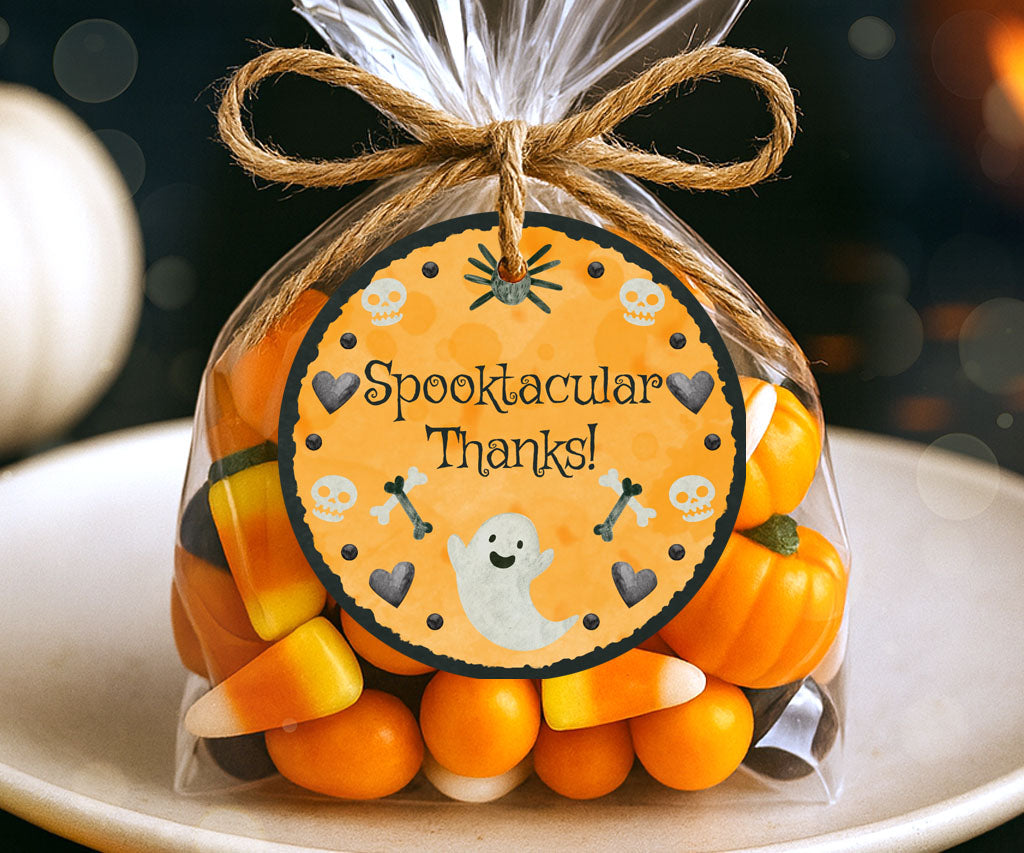 Round Halloween favor tag with friendly ghost, bones & skulls.