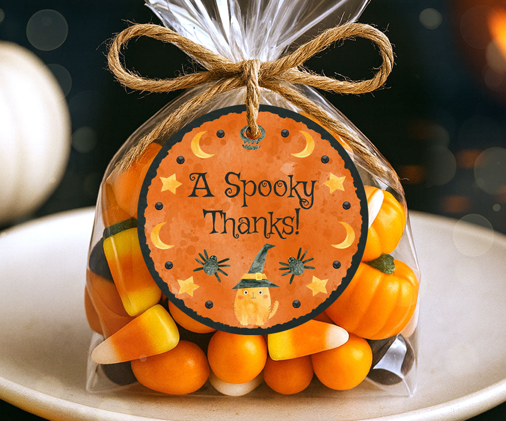 Round Halloween favor tag with a cute witchy cat and celestial accents.