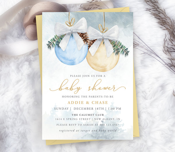 Winter Christmas boy baby shower invitation with blue and gold ornaments and pine greenery.