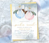 Winter gender reveal invitation with blue and gold ornaments.