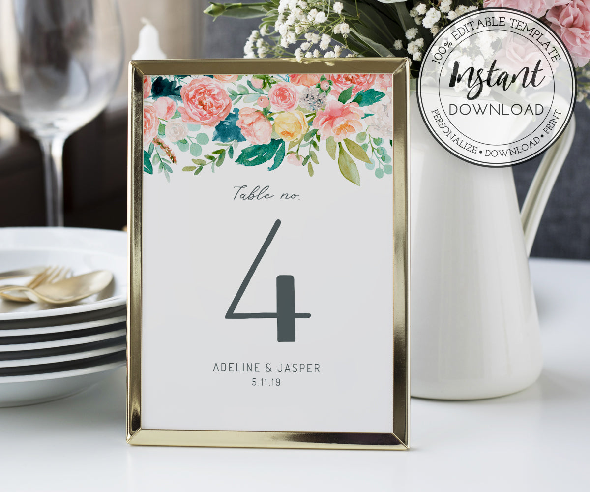 Pink floral table number in a frame on table for wedding or shower