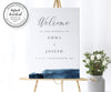 modern wedding welcome sign with blue watercolor accent, portrait orientation shown on an easel