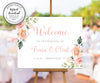 pink and white floral wedding welcome sign on easel